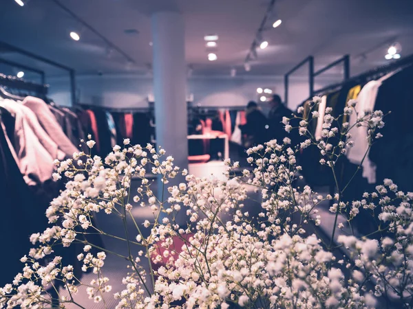 Defocused view of luxury fashion clothes store — Stock Photo, Image