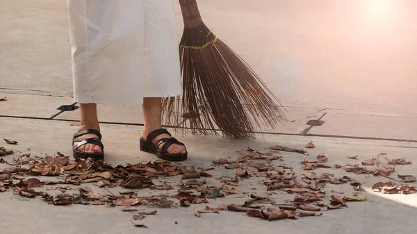 Woman Sweeping Dry Leaves Cement Floor Long Wood Broom Keeping — Stock Photo, Image