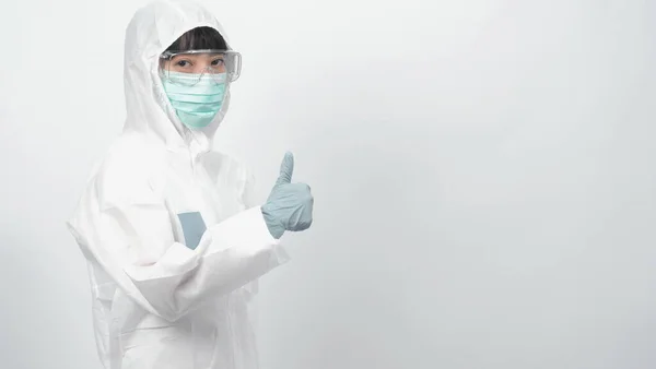 Woman doctor in PPE or personal protection equipment suit and medical mask and glove for protect corona virus or covid-19 and studio shot on white background and copy space