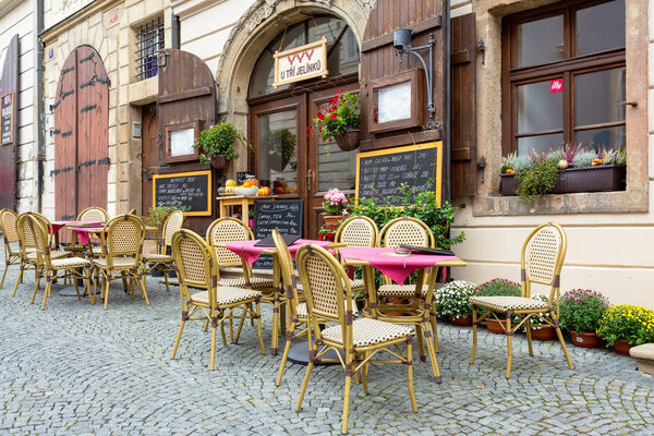 Outdoor cafe In Prague, there are tables on the street