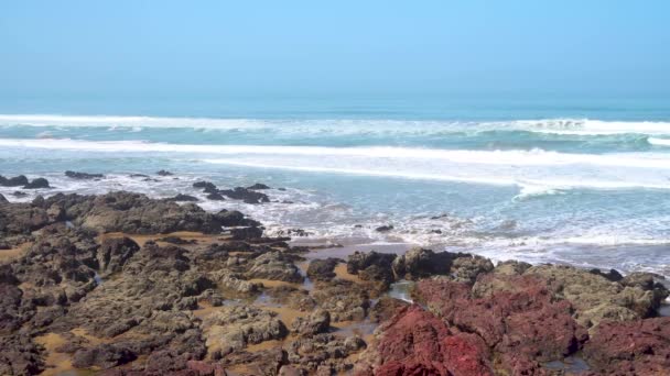 Perfect waves are breaking in front of the rocky shore of the desert of Morocco - Atlantic Ocean Africa — Stock Video