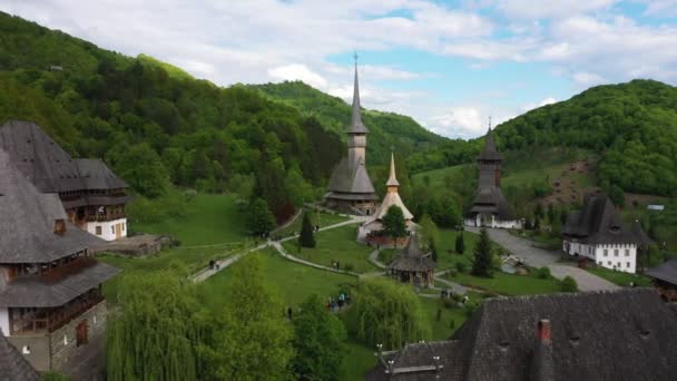 Aerial view over Barsana Monastery, Maramures - Romania. Wooden church UNESCO world heritage site — Stock Video