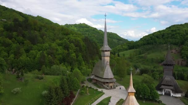 Aerial view over Barsana Monastery, Maramures - Romania. Wooden church UNESCO world heritage site — Stock Video