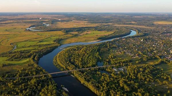 Aerial view of river flood. Beautiful flooded meadow. Flying above beautiful Desna river when the river is full of water at spring at National Nature Park in Chernihiv Oblast, Ukraine.