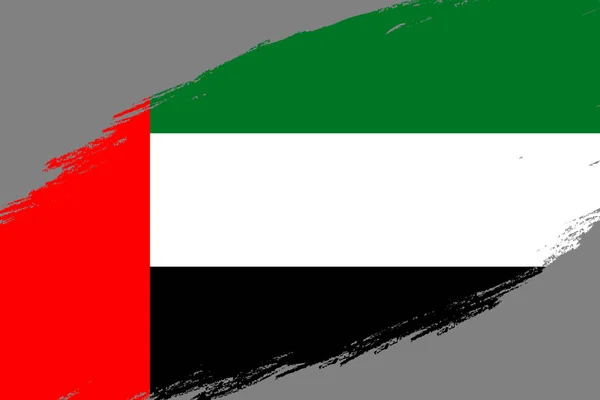 グランジのブラシ ストロークの背景スタイル アメリカ アラブ首長国連邦の国旗 — ストックベクタ