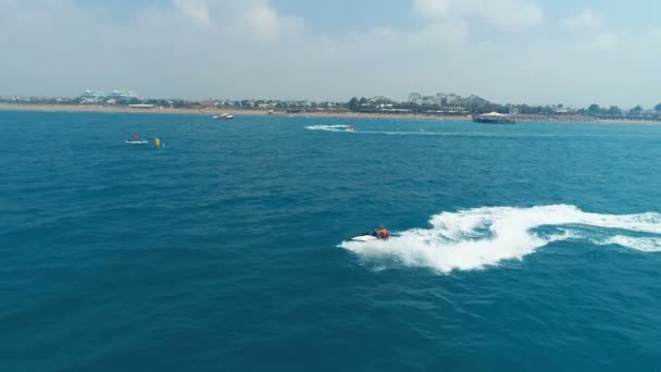Aerial View Over Man Speeding On Jet Ski Tourist Attraction Exotic Tropical Island Shore Beach At Exotic Extreme Sports Vacation Trip Tourism Sport Attraction Paradise Adventure Concept — Stok Video