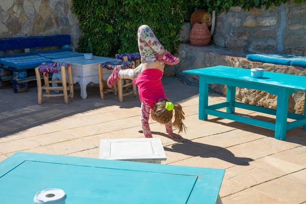 Four Years Old Blonde Girl Trying Somersault Handstand Floor Roof — Stock Photo, Image