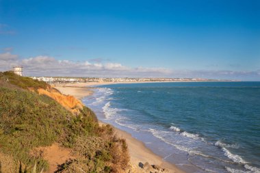 La Barrosa Beach in Chiclana de la Frontera, one of the most famous and large beaches in Cadiz (Andalusia, Spain, Europe), from the mountain clipart