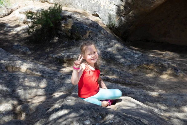 Portrait Four Years Old Blonde Cute Girl Sitting Rock Outdoors — Stock Photo, Image