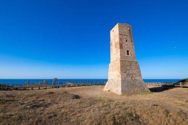 ancient Thieves Tower, from year 1500, in Artola Dunes, in Cabopino of Marbella town (Malaga, Andalusia, Spain, Europe) clipart