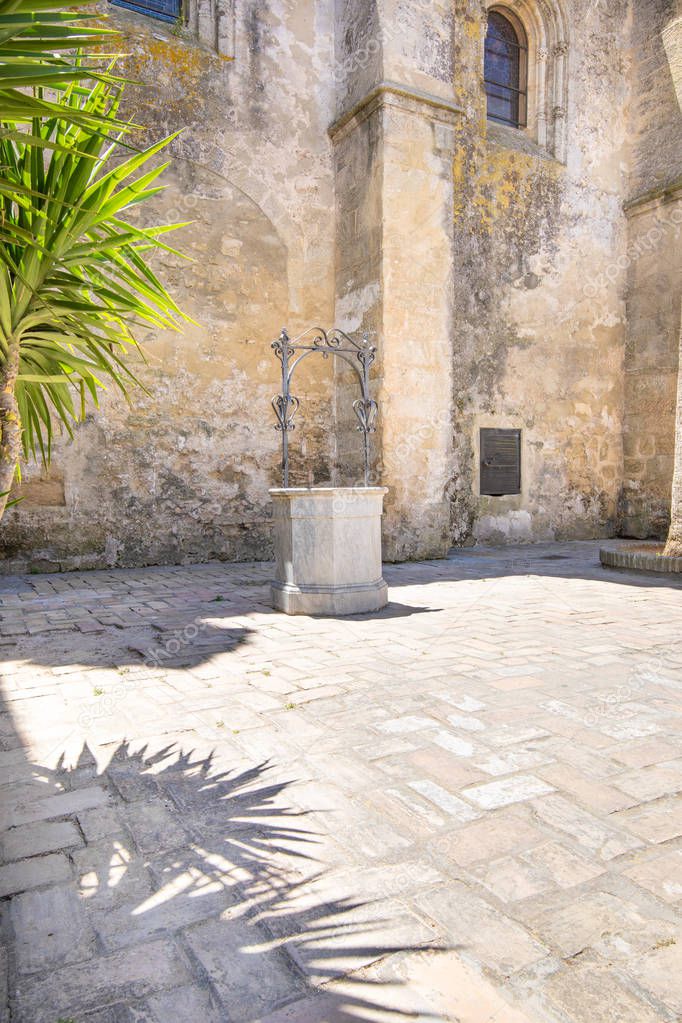 ancient water well in street of Vejer de la Frontera village