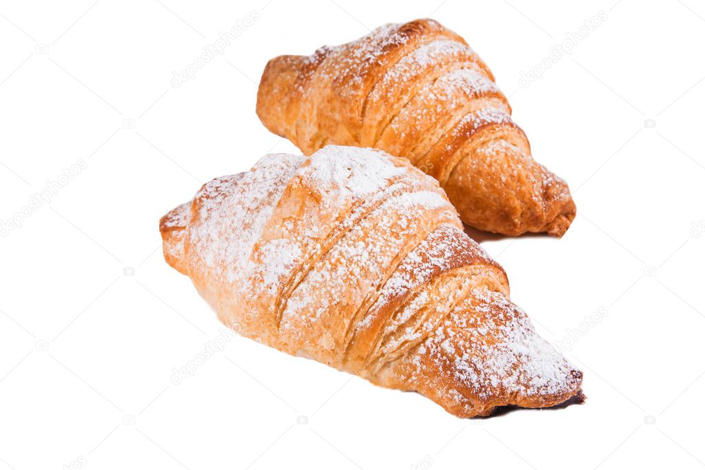 Sweet croissants with powdered sugar on white isolated background. Fresh pastries, bakery, cafe concept