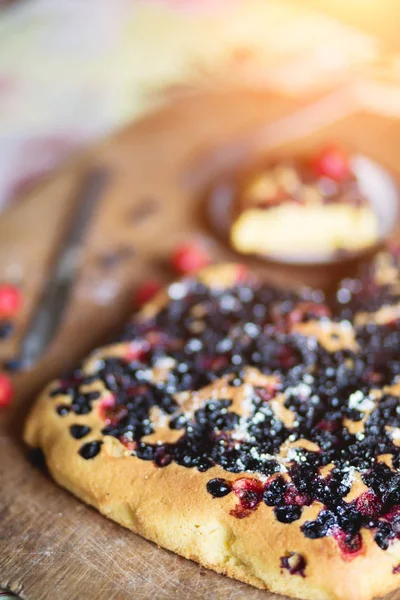 Close up delicious assorted cake of currants, blueberries, strawberries, cherry