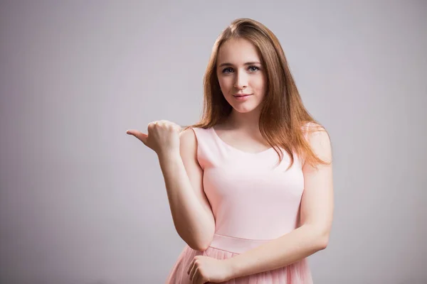 Young Beautiful Woman Pink Dress Pointing Finger Copy Space Grey — Stock Photo, Image