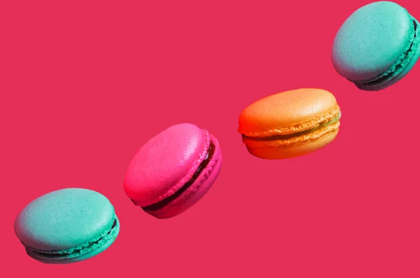 Different Types Macaroons Motion Falling Light Pink Background Closeup — Stock Photo, Image