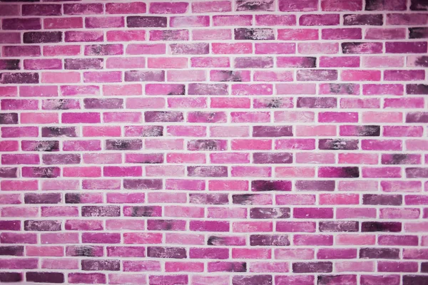 Beautiful pink purple brick wall with white grout, colorful background, abstract texture for copy space