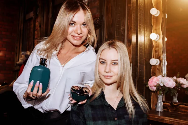 Woman holding products for hair care