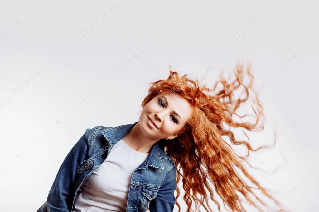 Living life to fullest. Portrait of attractive carefree european female with ginger hair, laughing out loud over white background, tilting head up, having fun