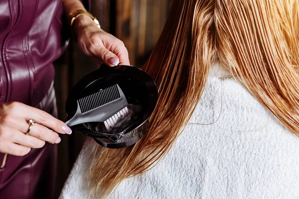 Beautiful woman in hair salon