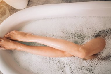Beautiful sexy woman in bubble bathtub clipart