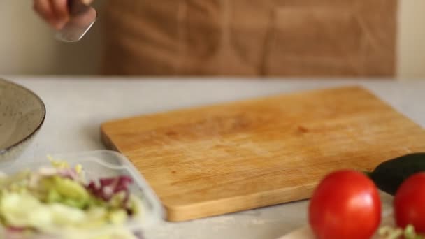 Closeup Woman Cuts Half Green Fresh Cucumber Wooden Board — Stock Video