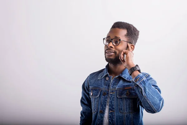 Studio shot of african guy in eyewear