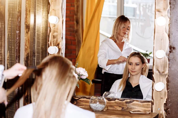 Beautiful woman in hair salon