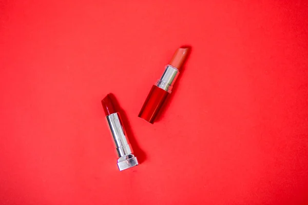 Lipstick isolated on red background — Stock Photo, Image
