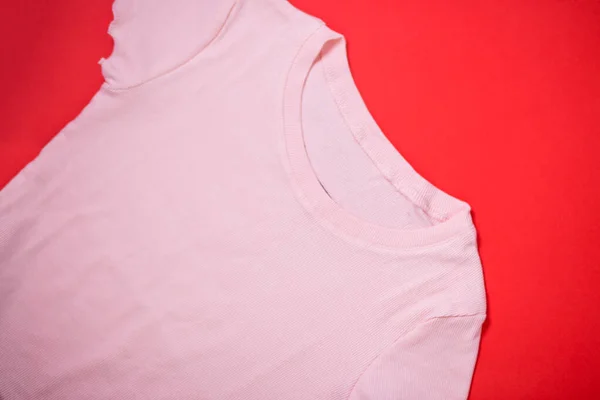 T-shirt on red background — Stock Photo, Image