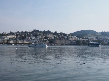 LUCERNE, SWITZERLAND on AUGUST 2018: Representative hotel buildings in european city promenade at cityscape landscapes of Vierwaldstattersee with clear blue sky in warm sunny summer day.