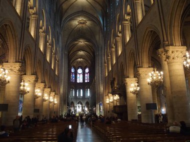 PARIS, FRANCE on April 2015: Interior of main nave at Notre-Dame cathedral, Our Lady of Paris in european capital city.