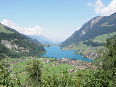 Beautiful european lake Brienz seen from Brunig Pass in Switzerland with clear blue sky in 2018 warm sunny summer day on August.