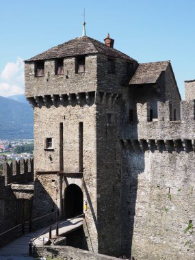 Towers of Montebello castle in european Bellinzona city, capital of canton Ticino in Switzerland, clear blue sky in 2017 warm sunny summer day on July - vertical.