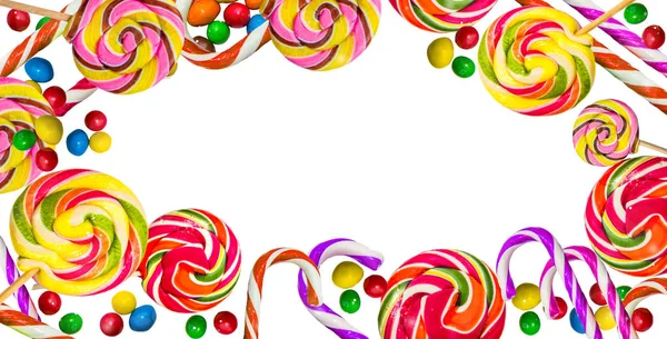 Multicolored frame of sweets. Lollipops on a white background. — Stock Photo, Image