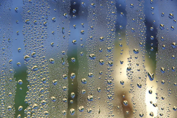 Background. Misted glass with small drops of condensate.