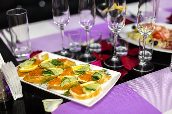 Served holiday table with different tasty dishes — Stock Photo, Image