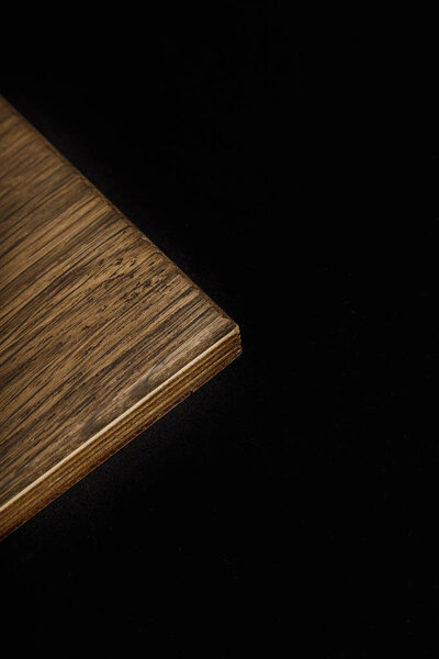Wooden product made of wood on a black background