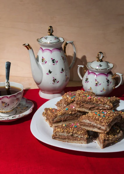 Cakes with a colorful sprinkling of stars on a white plate — Stock Photo, Image