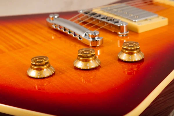 Old beautiful electric guitar on a background of wood. — Stock Photo, Image