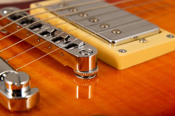 Old beautiful electric guitar on a background of wood. — Stock Photo, Image