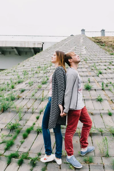 Stock image Two lovers walk around the park, kiss and hug, a love story.