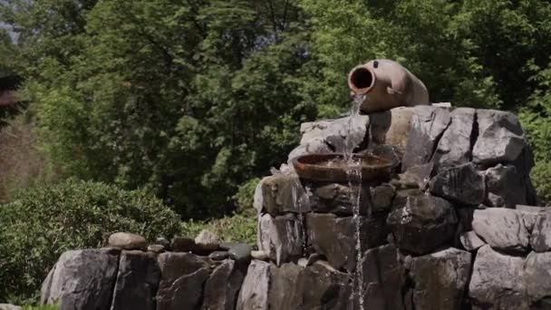 Fountain in the courtyard of a house made of natural stones — Stock Video