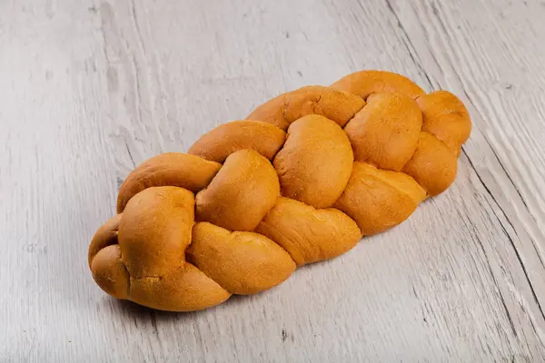 Freshly baked bread on a wooden background. — Stock Photo, Image