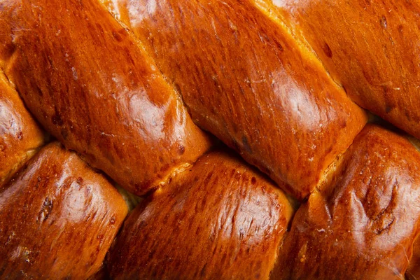 Freshly baked bread on a wooden background. — Stock Photo, Image