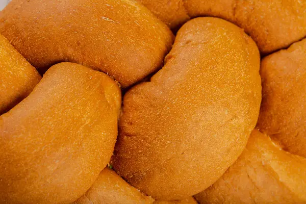 Freshly baked bread on a wooden background. — Stock Photo, Image