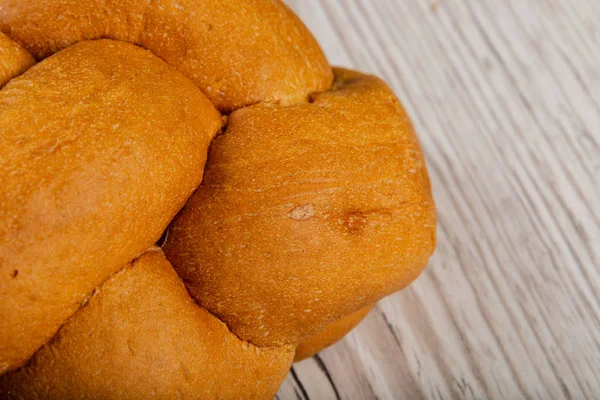 Freshly baked bread on a wooden background. — Stock Photo, Image