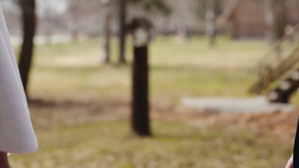 A loving couple holds hands on their wedding day — Stock Video