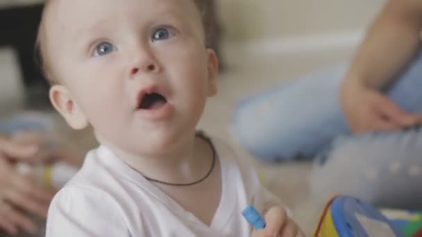 Father and mother are playing with their little child. Family at home — Stock Video