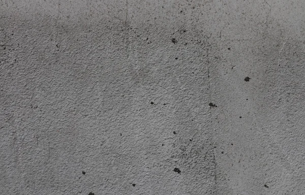 Fundo cinza de concreto com poços e entalhes . — Fotografia de Stock