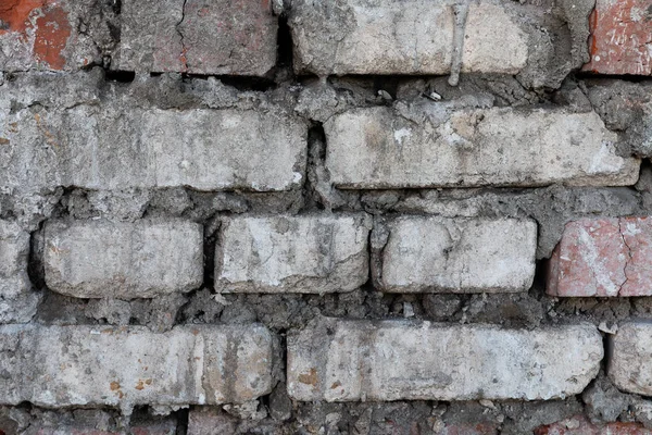 Fond gris de béton avec des fosses et des entailles . — Photo